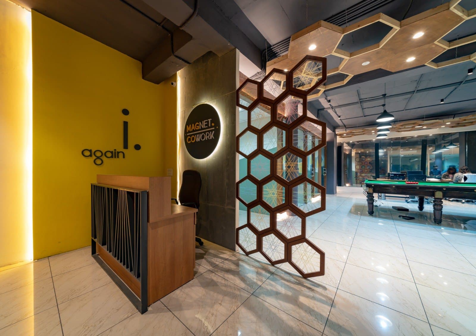 Reception fit-out with a wood hexagon partition